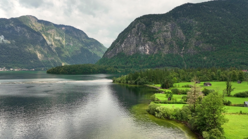 beautiful alpine lake in Austria, Hallstattersee in the Austrian Alps, tranquil atmospheric natural landscape with turquoise mountain lake, European Alps tourism. High quality 4k footage