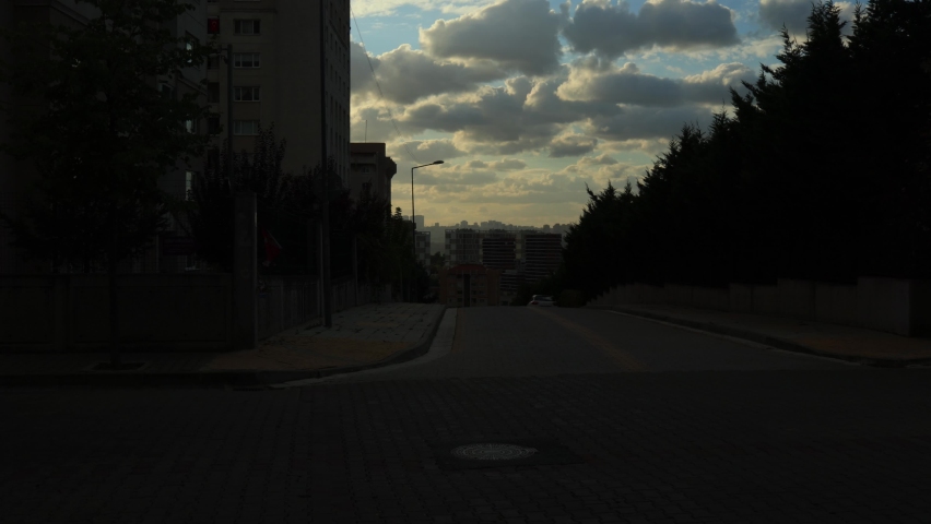Sky over the city of Istanbul. Orange Sunset light and Darkness.