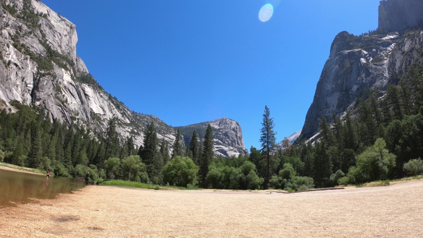 PAN SHOT - A dry Mirror Meadow during the summer in Yosemite National Park, California, USA. During the spring and early summer, the shallow lake refills with water and becomes Mirror Lake.