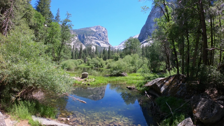 SLOW MOTION SHOT - The Mirror Lake is a small, seasonal lake located on Tenaya Creek in Yosemite National Park, California, USA. Situated in Tenaya Canyon directly between North Dome and Half Dome.