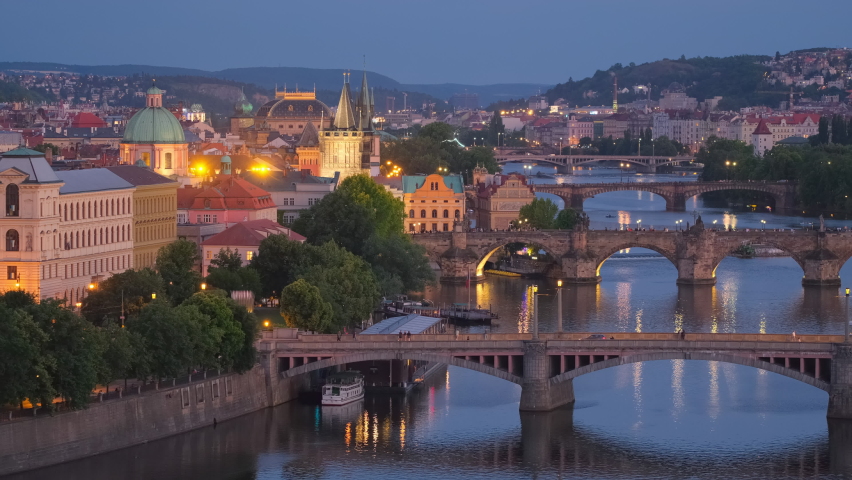 Prague cityscape at night. Prague old town, Charles bridge and Vltava river, Czech Republic. View of famouse Prague old bridges over the Vltava river at twilight Czech capital city.