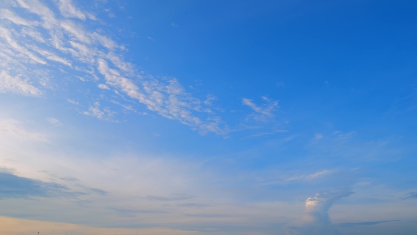 4K timelapse of beautiful blue sky with clouds background, Blue sky with clouds and sun. cloud time lapse nature background. Summer sky
 Royalty-Free Stock Footage #1093983633