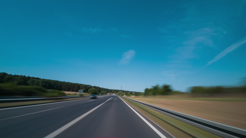Open Road Fast Car Hyper lapse Germany, France. Road Trip Travel Concept. Road through landscape. Motion  Timelapse of a Speedy Drive. Fast Car Hyperlapse Car Driving.  Royalty-Free Stock Footage #1093996951