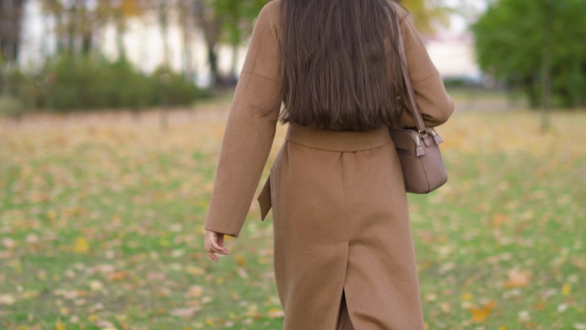 Back View Torso Woman Walking Around Park
