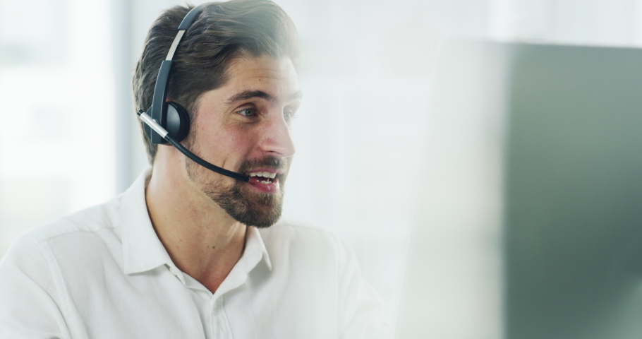 Support call center agent working, helping and consulting with online IT, tech software or telemarketing. Male ecommerce or contact us worker talking with headset, virtual assistance to website user | Shutterstock HD Video #1093999623