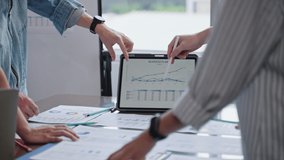 Group of asian business team meeting brainstorming ideas about on tablet,colleagues working together planning success strategy enjoy in modern office on city background.statistics success concept - Powered by Shutterstock - Get 15% off with code: PIKWIZARD15