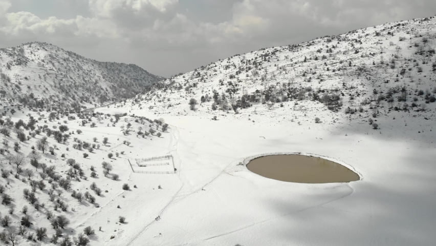 Hermon mountain with lake and trees, flight, 2021
Snow covered limestone mountain foothills, drone view, 2021
