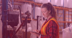 Animation of caucasian female worker using tablet in warehouse. work and business concept digitally generated video.