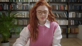 Woman with redhead working from home at her desk opens laptop computer. Student girl opening notebook and start typing writes email surfs the internet - Powered by Shutterstock - Get 15% off with code: PIKWIZARD15