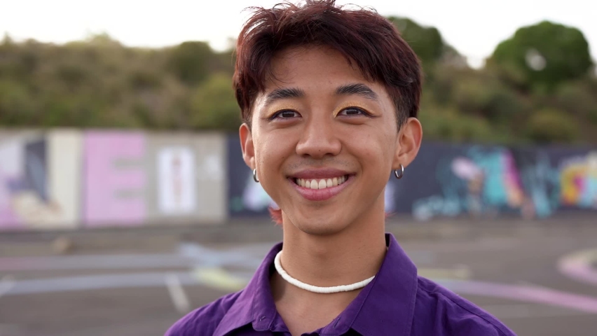 Young asian man with make up smiling on camera Royalty-Free Stock Footage #1094015569