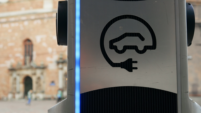 Close view: Modern electric car charger in an old european city