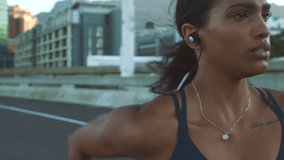 Motivation, music and running with fitness woman training run for health, wellness and exercise in urban street or road. Sport, workout and energy girl runner working out for event, race or marathon - Powered by Shutterstock - Get 15% off with code: PIKWIZARD15
