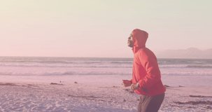 Animation of african american man running at beach. health and fitness concept digitally generated video.