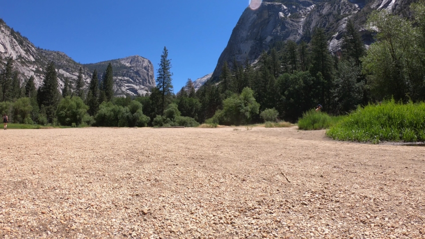 SLOW MOTION SHOT - A dry Mirror Meadow during the summer in Yosemite National Park, California, USA. During the spring and early summer, the shallow lake refills with water and becomes Mirror Lake.