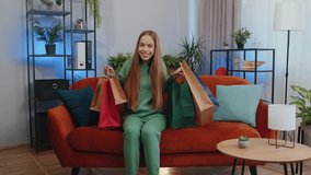 Portrait of caucasian teen girl happy shopaholic consumer came back home after shopping sale with bags. Young child kid satisfied received parcels from online order at home apartment living room - Powered by Shutterstock - Get 15% off with code: PIKWIZARD15