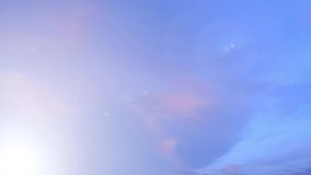 Bokeh sun light ray n bright lens flare sunbeam shine through pastel pink cloud n colorful cloudscap on sunrise or sunset blue sky in tropical summer sunlight n sunray, 4k cinemagraph b-roll TimeLapse - Powered by Shutterstock - Get 15% off with code: PIKWIZARD15