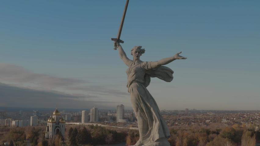Huge monument to the Motherland at dawn. Mamaev kurgan. Russia. Circular flight of the drone.