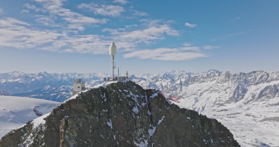 Aerial drone fly around Matterhorn Glacier Paradise during winter in Switzerland. Majestic mountain peaks iconic famous zermatt travel ski resort in the alps. Wonderful inspiring nature landscape.