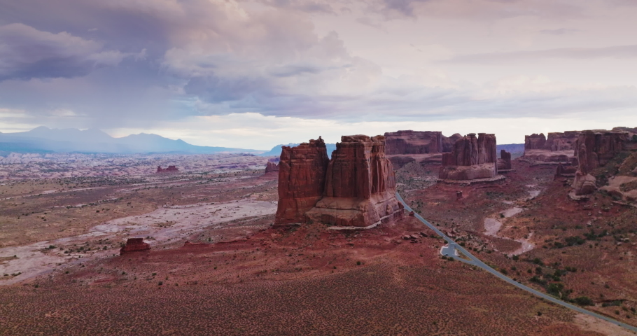 Arches national park in the cloudy daytime. Scenic view of tremendous rocks among the desert plain. Aerial view.