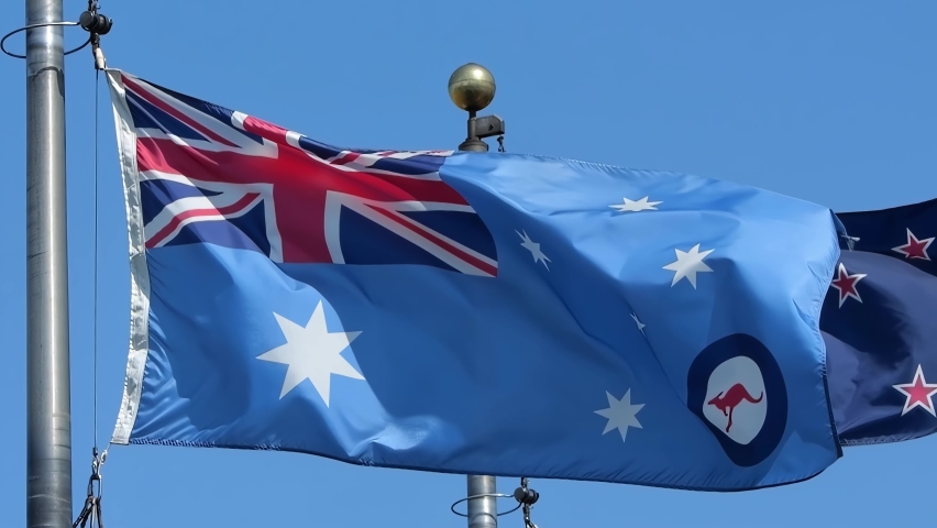 A waving Royal Australian Air Force Ensign flag during sunny day. 