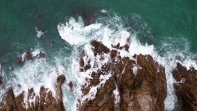 Aerial view seashore cliffs wave crashing on rocks,  Beautiful dark sea surface in sunny day at the phuket island, Phuket Thailand - Powered by Shutterstock - Get 15% off with code: PIKWIZARD15