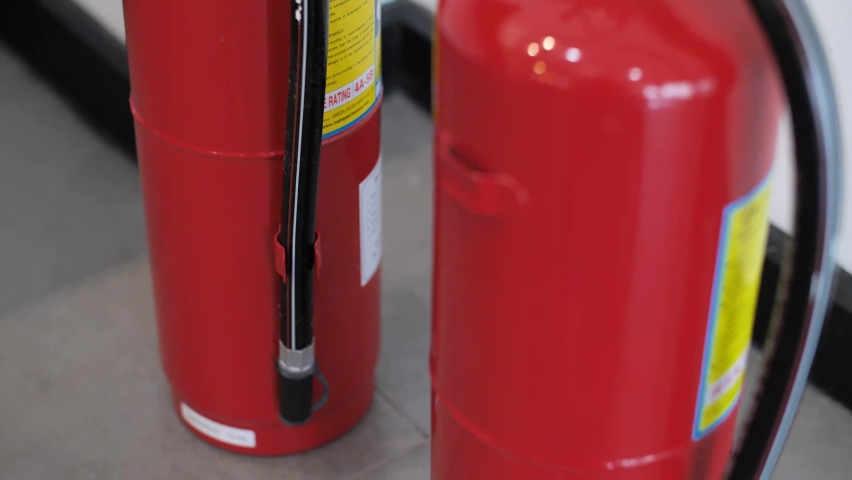 Fire Extinguishers. fire extinguishers to extinguish fires from fuel in house or industry for safety. Royalty-Free Stock Footage #1094069545