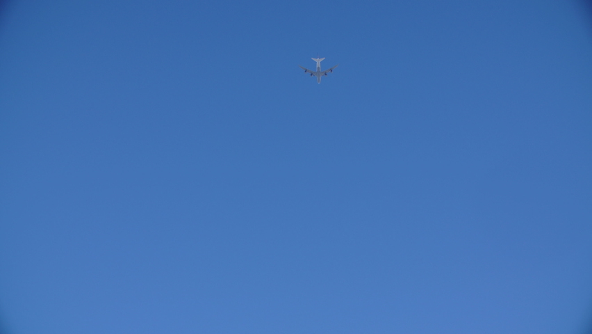 Lockdown Low Angle View Of Airplane Flying In Sky On Sunny Day - Santa Monica, California Royalty-Free Stock Footage #1094076263