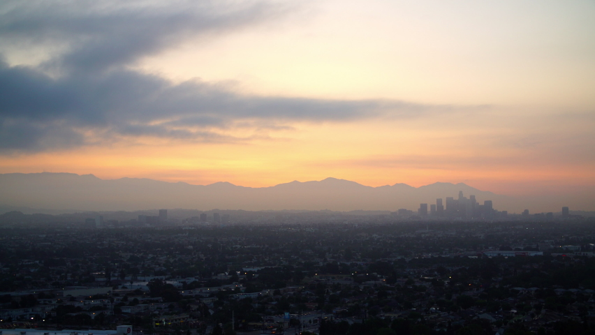 Aerial Lockdown Scenic Shot Of City Landscape By Mountains Under Cloudy Sky In City - Los Angeles, California