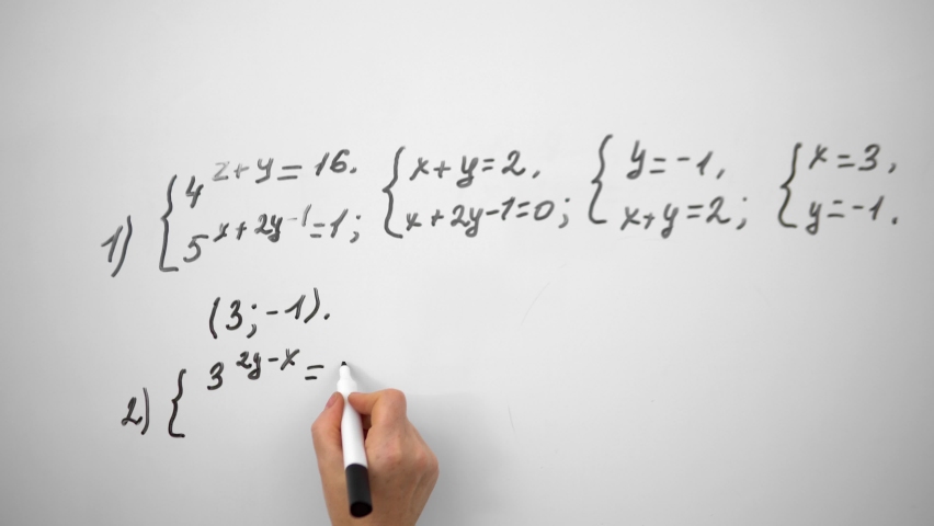 Writing mathematics equation on whiteboard.Education concept.