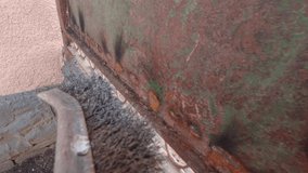Brushing old rusty gates slow motion of old paint - Powered by Shutterstock - Get 15% off with code: PIKWIZARD15
