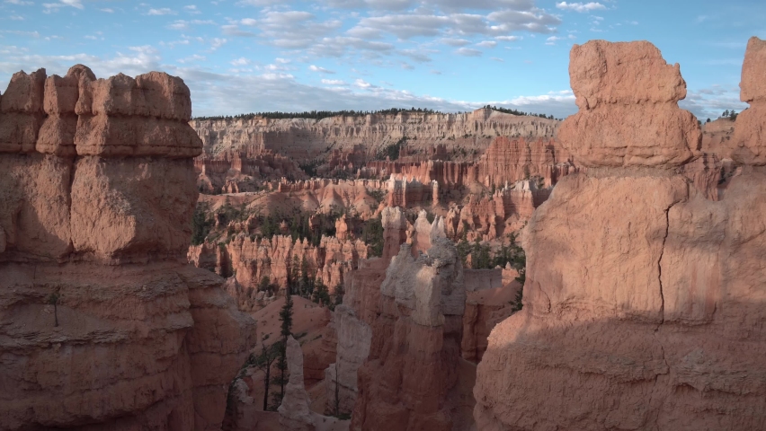Bryce Canyon National Park Utah sunrise point area with towering formations, Aerial dolly left shot