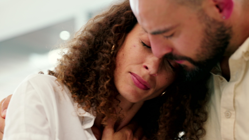 Crying, support and sad couple hugging while overcoming a anxiety problem, cheating or loss. Grief and mourning woman depressed while man show love and care after cancer, miscarriage or infertility Royalty-Free Stock Footage #1094098033