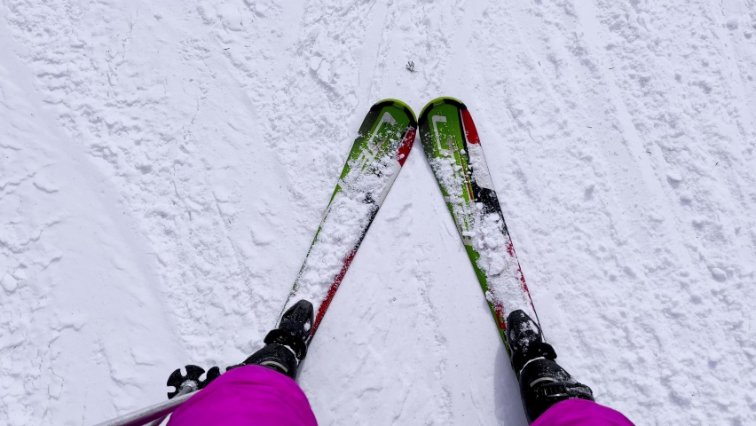 4K FPV skiing footage, one woman skilled skier skiing on ski slope on winter vacation day during ski holidays. Woman on ski going downhill having fun on the trails Idyllic mountain winter forest snow Royalty-Free Stock Footage #1094098733