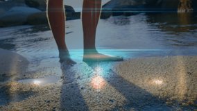 Animation of light spots over caucasian woman at beach. Global sport and digital interface concept digitally generated video.