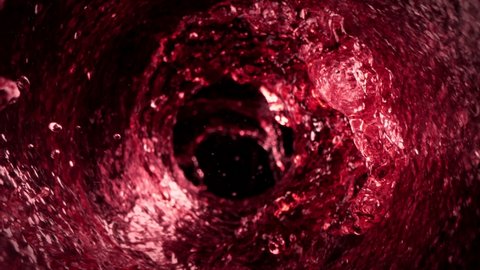 Super Slow Motion Shot of Red Wine Rotating Around in Glass Bottle at 1000fps. วิดีโอสต็อก