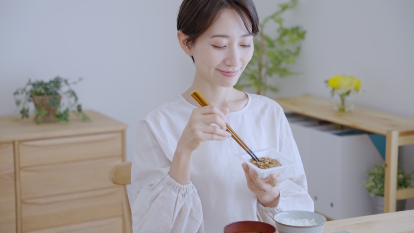 Asian woman eating a meal Royalty-Free Stock Footage #1094111991