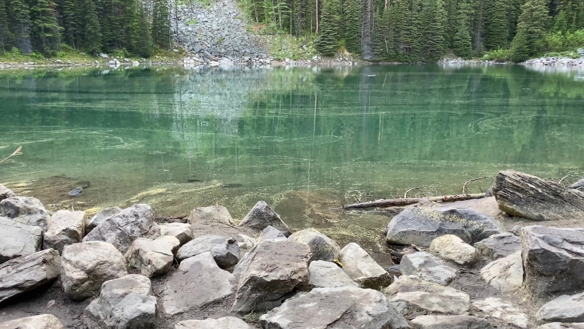 Panning shot of Mirror Lake and Big Beehive in Banff National Park