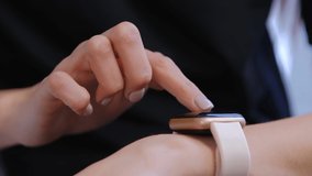 Girl using smartwatch gadget. Woman communicating online with modern smart wrist watches connected to internet. Female person use smartwatches in 4k stock video clip