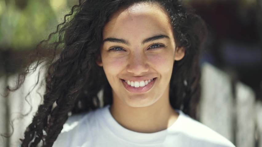 Beautiful mixed race latina girl smiling. charming smile, happy Gen Z young adult. Happy positive beautiful 20s female. Natural portrait slow motion 4k. | Shutterstock HD Video #1094126243