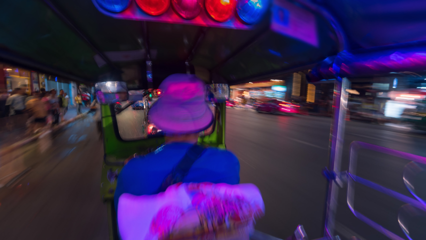 4K Hyper lapse of Tuk Tuk car riding in Bangkok Thailand at night Royalty-Free Stock Footage #1094140675