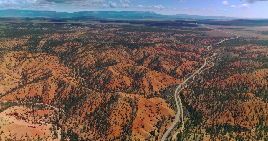 Stunning mountainous panorama of Zion National Park, Utah, USA. Long motorway going through vast territory of park. Aerial perspective. Royalty-Free Stock Footage #1094141895