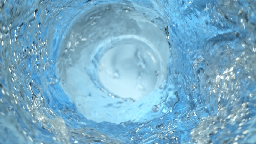 Super Slow Motion Shot of Whirling and Splashing Water in Glass Bottle at 1000fps. - Powered by Shutterstock - Get 15% off with code: PIKWIZARD15