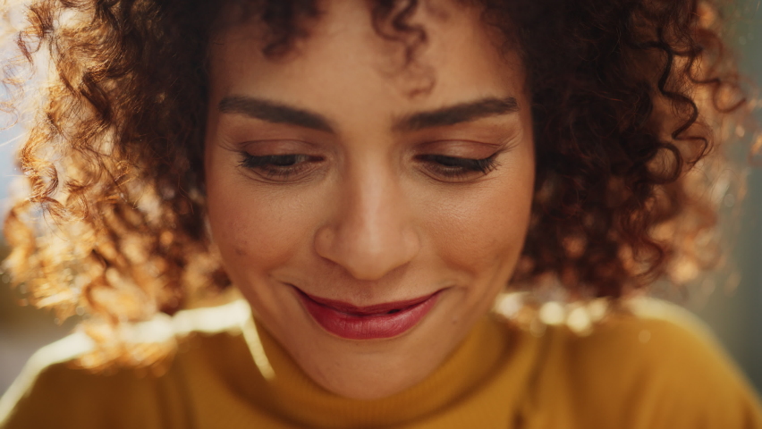 Close Up Portrait of a Beautiful Multiethnic Middle Eastern Woman with Brown Eyes and Curly Hair. Talented Young Female Smiling Charmingly, Motivating Viewer for Better Life Choices. Royalty-Free Stock Footage #1094152455