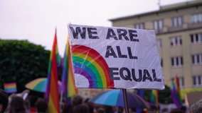 LGBT equality march. Fight for LGBTQ+ rights. Rainbow flags and banners. Struggle for LGBT rights. We are all equal banner. - Powered by Shutterstock - Get 15% off with code: PIKWIZARD15