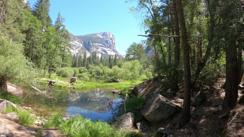 The Mirror Lake is a small, seasonal lake located on Tenaya Creek in Yosemite National Park, California, USA. Situated in Tenaya Canyon directly between North Dome and Half Dome. Royalty-Free Stock Footage #1094169067