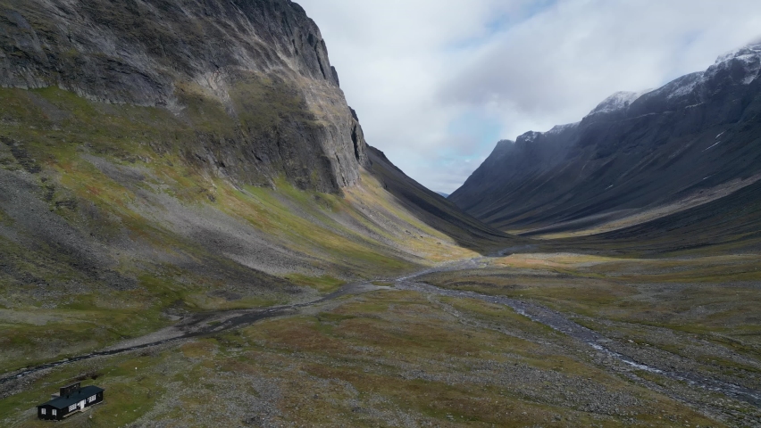 Nallo Mountain hut at one of the hiking trail near Kungsleden, Lapland, Sweden. Aerial drone footage.