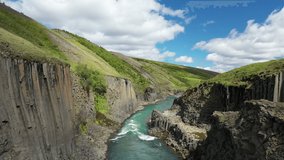 Studlagil canyon in iceland. Basalt columns. Aerial drone video of Icelandic landscape. Famous tourist attractions and landmarks destinations in Icelandic nature