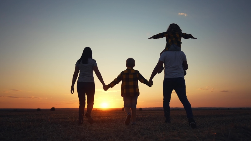 people in the park. friendly family a walking holding hands. happy family kid dream concept. big family walk on vacation running together in nature in the park lifestyle. silhouette happy family Royalty-Free Stock Footage #1094179017