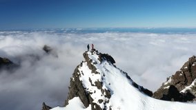 Two friends are standing together on the edge of the mountain Pico Ruivo in Madeira. - Powered by Shutterstock - Get 15% off with code: PIKWIZARD15