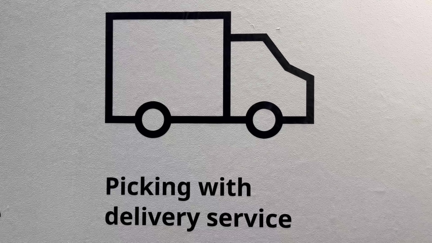 A close up shot of a designed of truck drawn in black and white in banner template and saying Picking with delivery service